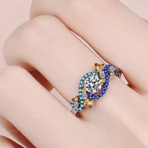 Moissanite Infinity Style Sterling Silver Ring